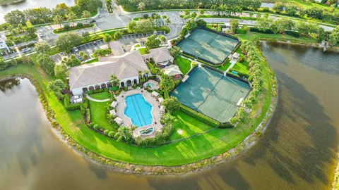 a view of a dining room with furniture and a potted plant