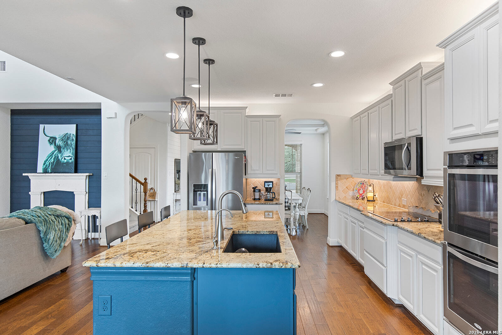8039 Cibolo Valley Fair Oaks Ranch, TX 78015 - Photo 12 of 63 a kitchen with kitchen island granite countertop a sink stainless steel appliances and cabinets