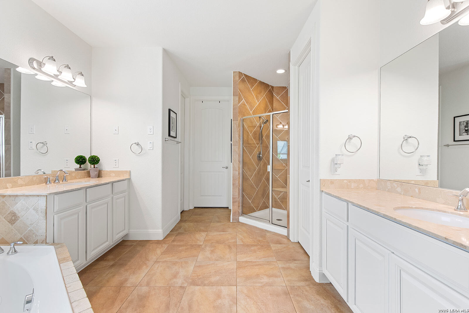 8039 Cibolo Valley Fair Oaks Ranch, TX 78015 - Photo 25 of 63 a spacious bathroom with a granite countertop sink mirror and shower