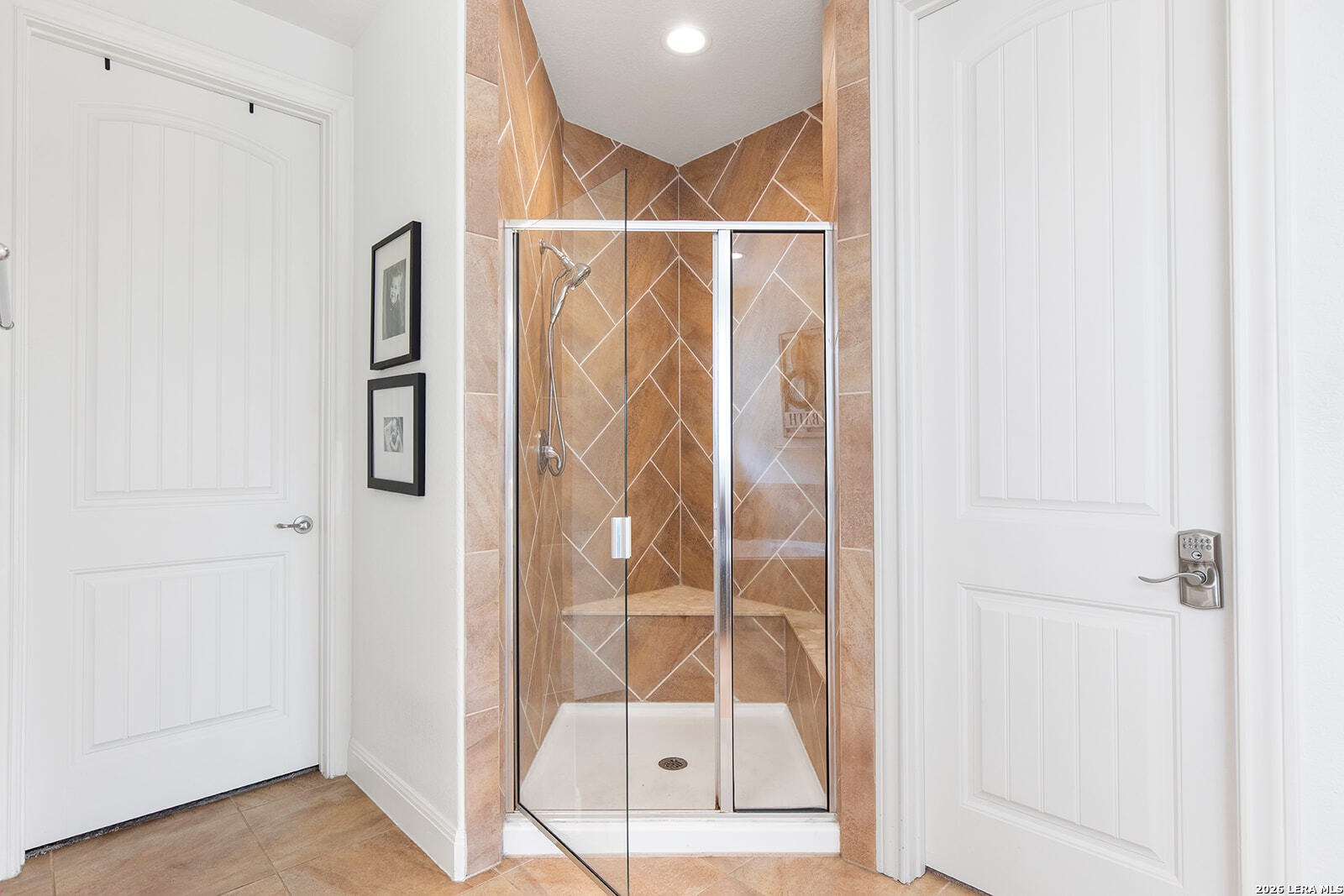 8039 Cibolo Valley Fair Oaks Ranch, TX 78015 - Photo 29 of 63 a bathroom with a glass door shower and a sink