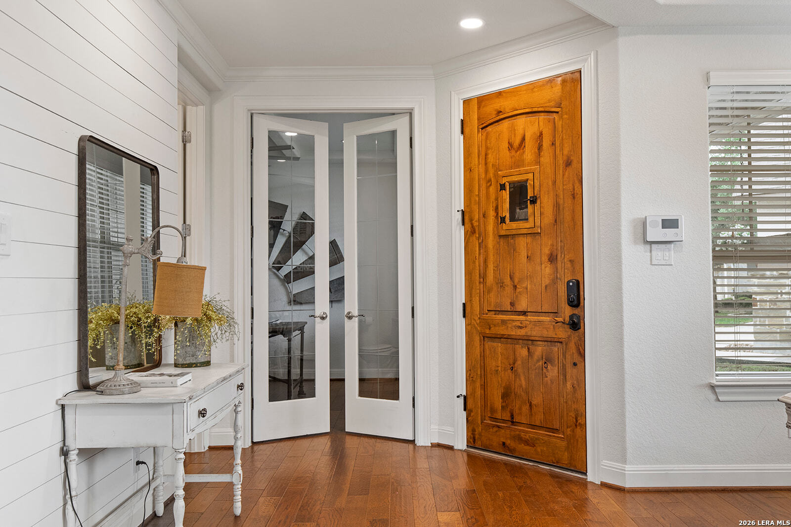 8039 Cibolo Valley Fair Oaks Ranch, TX 78015 - Photo 3 of 63 a view of a hallway with wooden floor and entryway