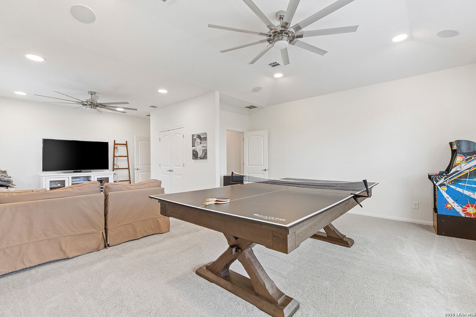 8039 Cibolo Valley Fair Oaks Ranch, TX 78015 - Photo 32 of 63 a living room with furniture and a flat screen tv