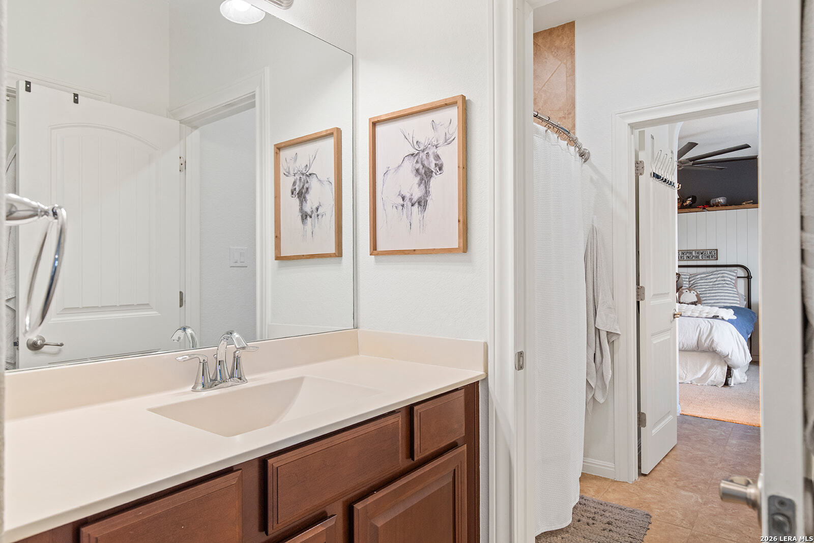 8039 Cibolo Valley Fair Oaks Ranch, TX 78015 - Photo 39 of 63 a bathroom with a sink and a mirror