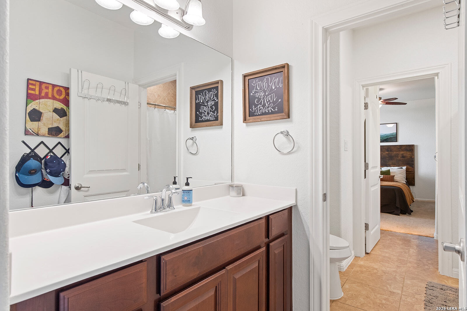 8039 Cibolo Valley Fair Oaks Ranch, TX 78015 - Photo 40 of 63 a bathroom with a sink and a mirror