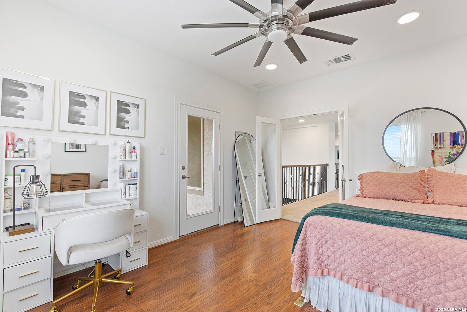 8039 Cibolo Valley Fair Oaks Ranch, TX 78015 - Photo 45 of 63 a bedroom with a bed window and a chandelier