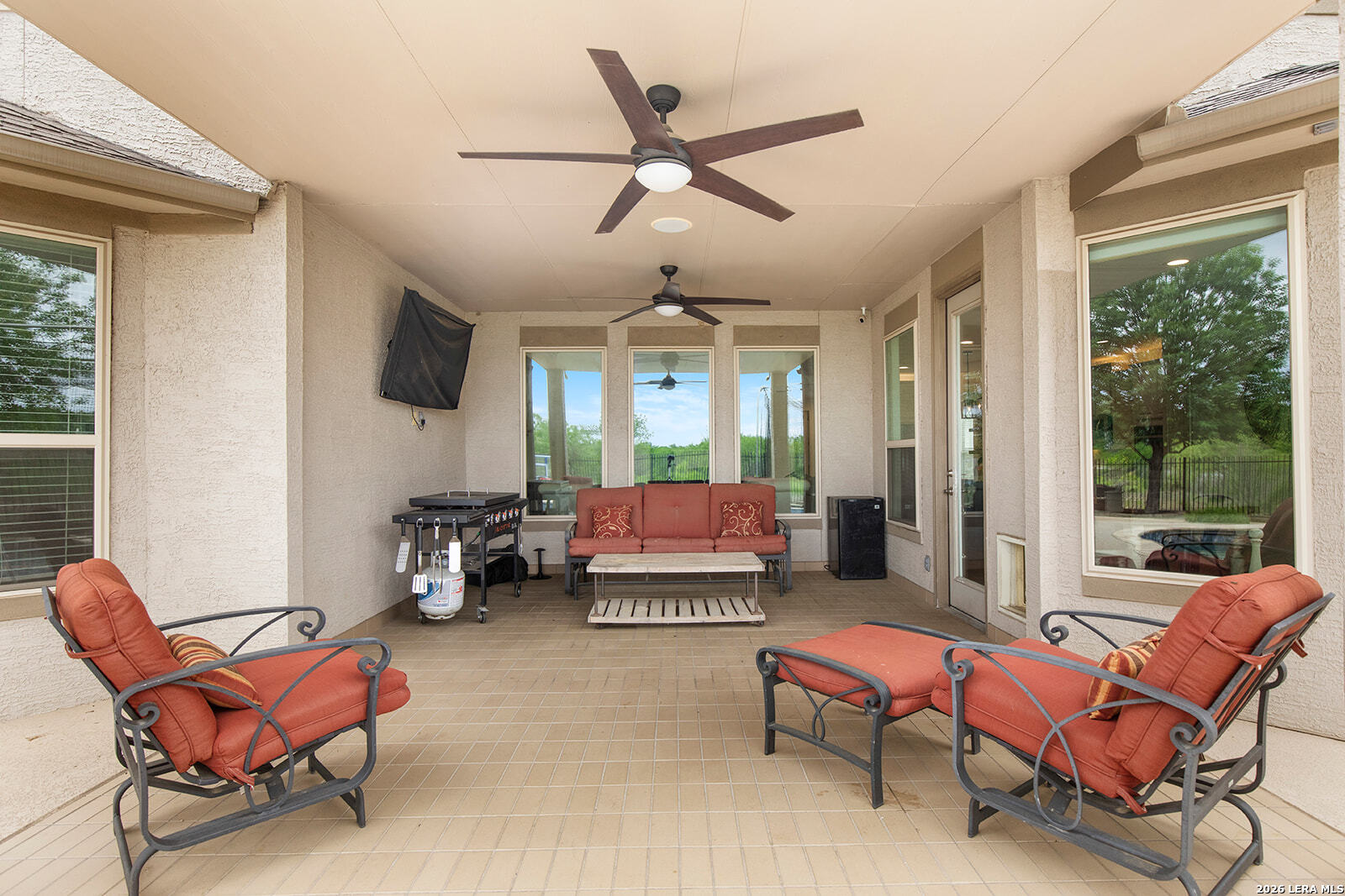 8039 Cibolo Valley Fair Oaks Ranch, TX 78015 - Photo 51 of 63 a living room with furniture a ceiling fan and a window