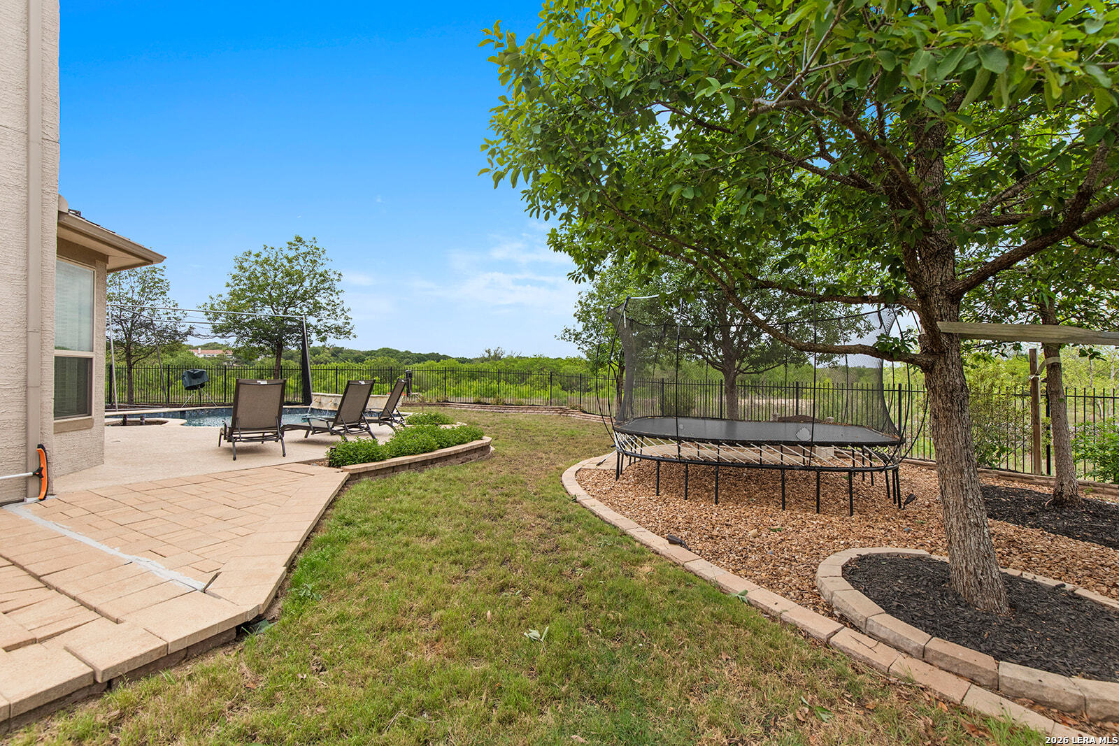 8039 Cibolo Valley Fair Oaks Ranch, TX 78015 - Photo 53 of 63 a view of a swimming pool with a patio