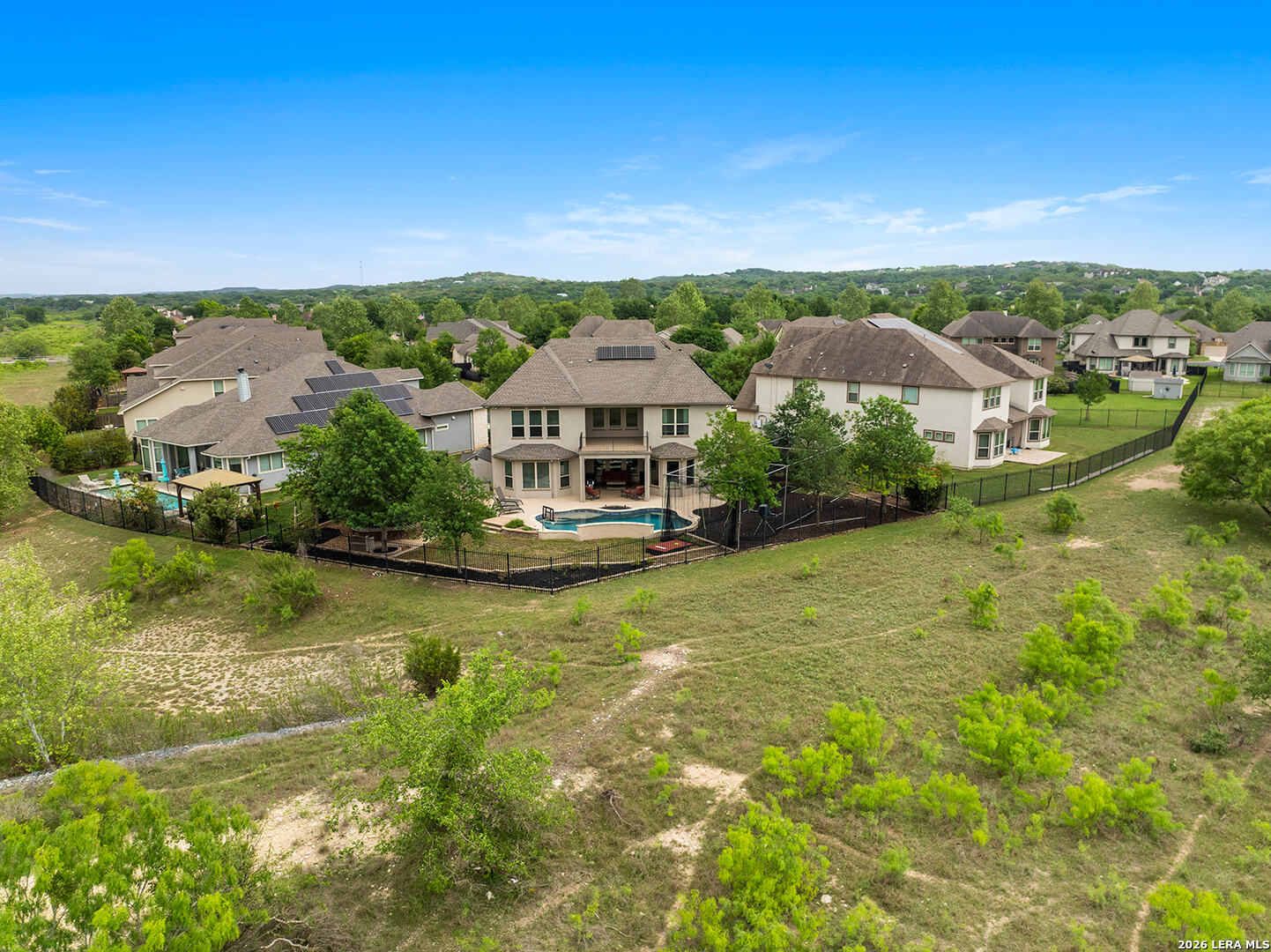 8039 Cibolo Valley Fair Oaks Ranch, TX 78015 - Photo 57 of 63 an aerial view of residential houses with outdoor space and trees