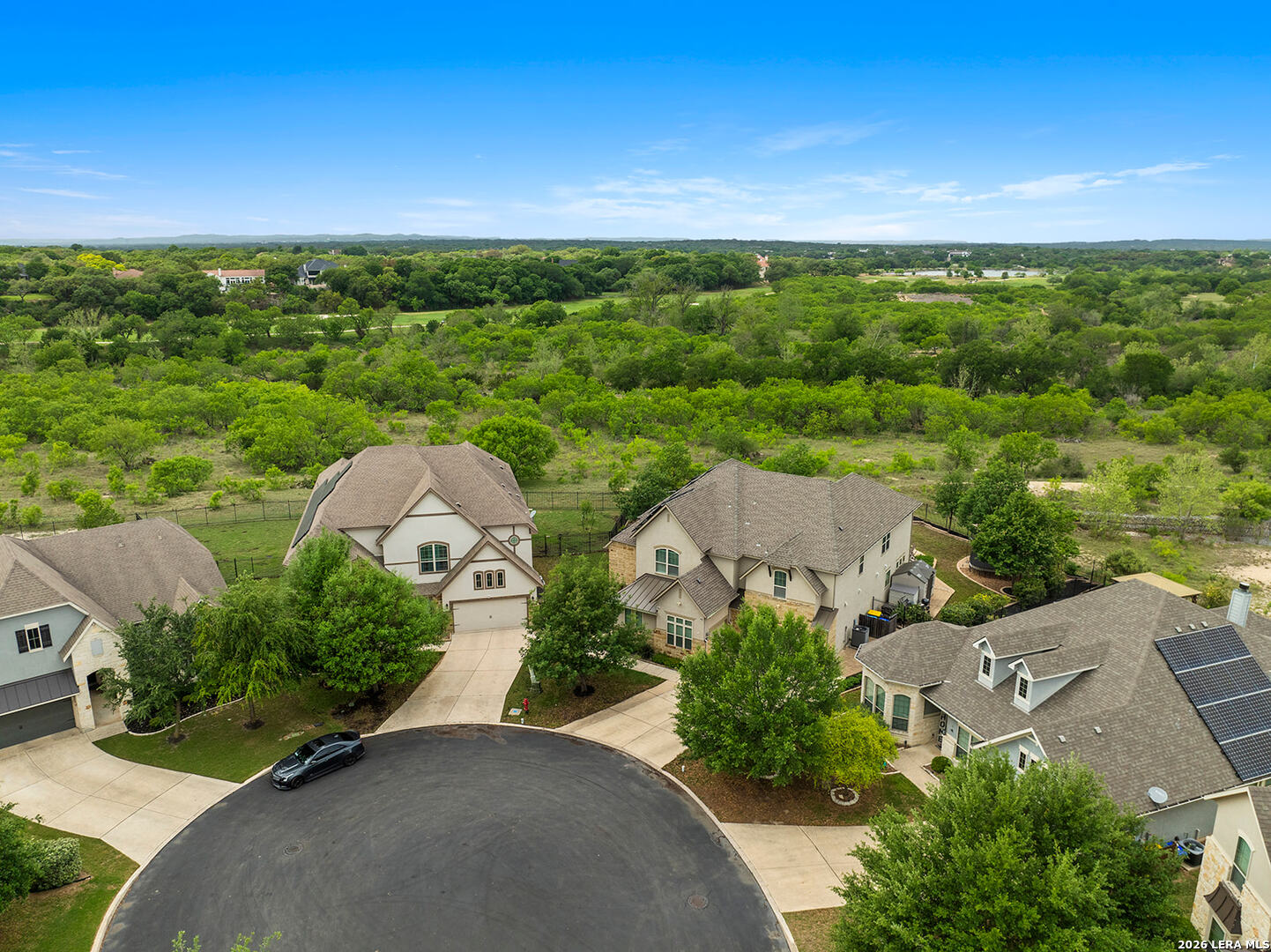 8039 Cibolo Valley Fair Oaks Ranch, TX 78015 - Photo 58 of 63 an aerial view of a house with garden space and street view