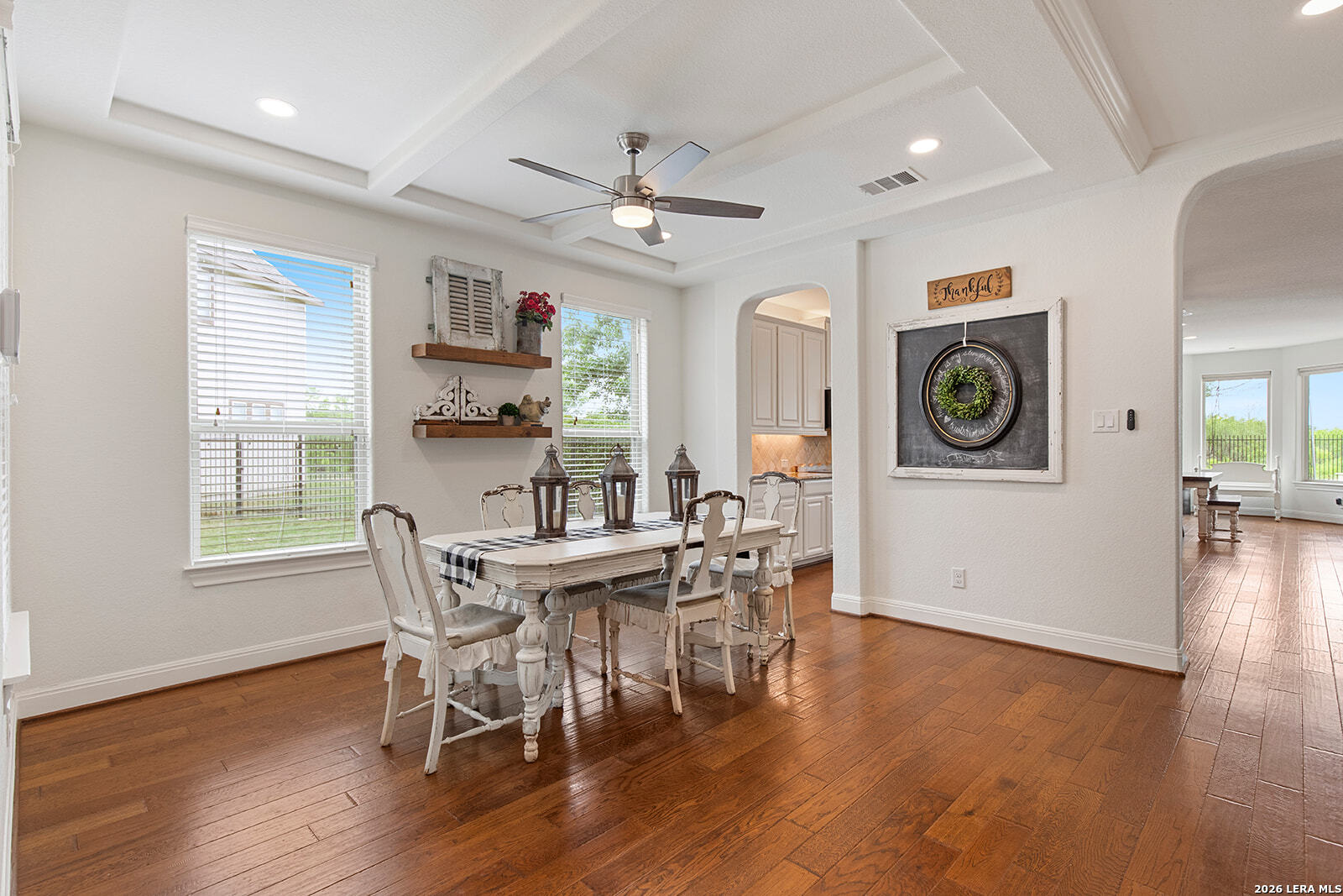 8039 Cibolo Valley Fair Oaks Ranch, TX 78015 - Photo 6 of 63 a dining room with wooden floor and a window