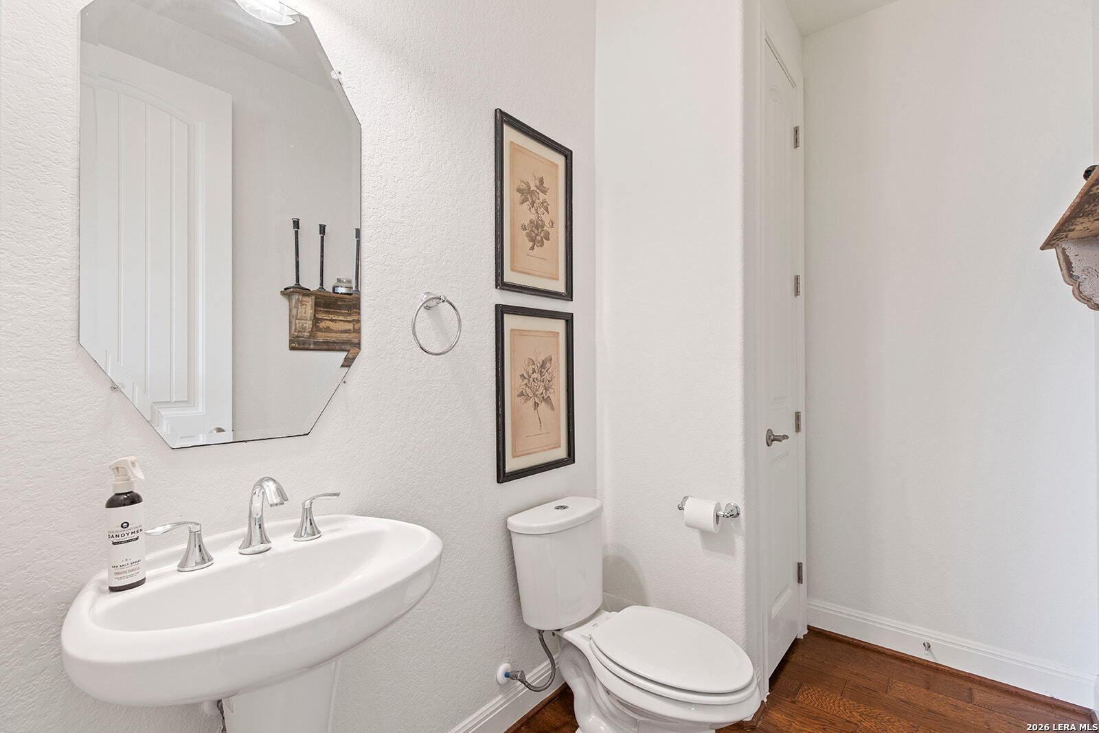 8039 Cibolo Valley Fair Oaks Ranch, TX 78015 - Photo 9 of 63 a bathroom with a toilet a sink and mirror
