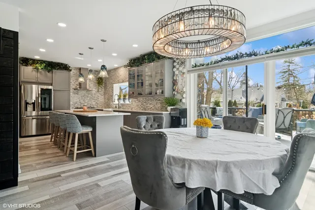 a dining table with a large kitchen view