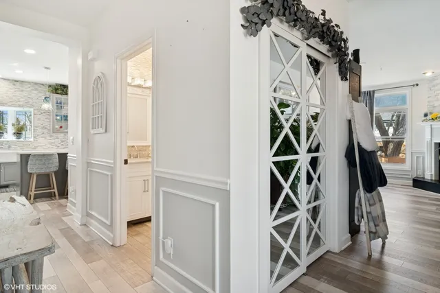a view of an entryway with wooden floor