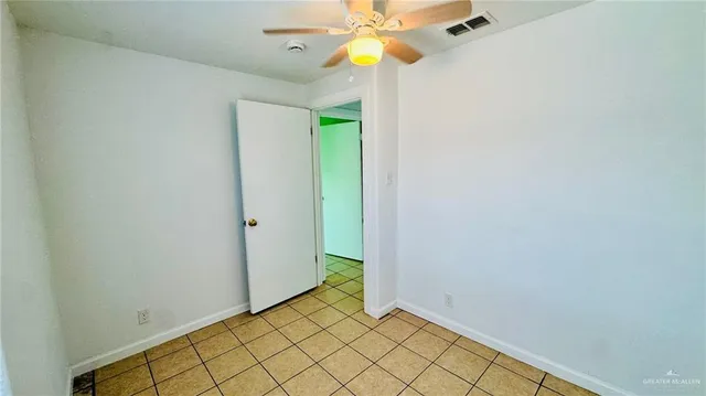 a view of an entryway with a chandelier fan