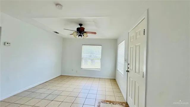 a view of an empty room and window