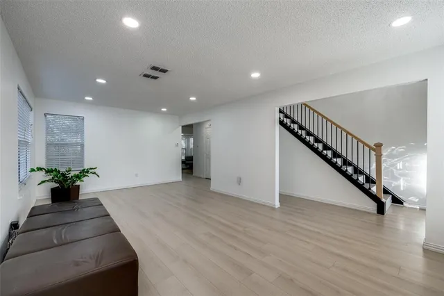 a view of an entryway with wooden floor