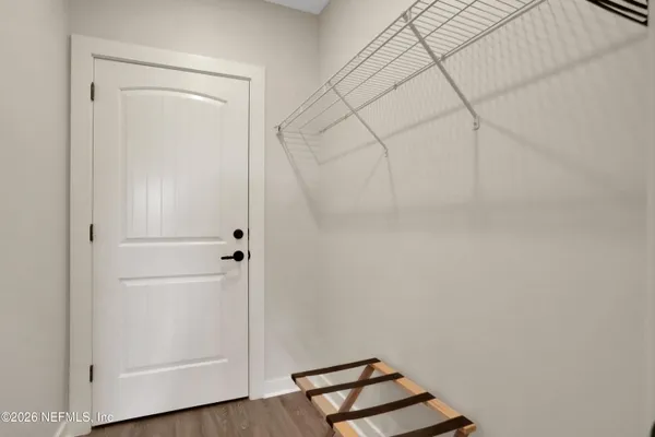 a room with a bench and cabinets