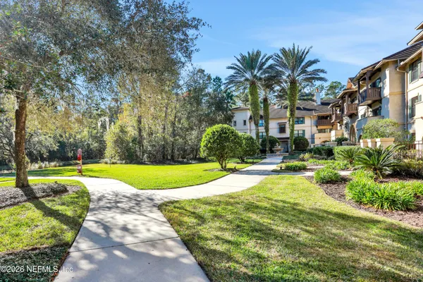 a view of backyard with swimming pool and outdoor seating
