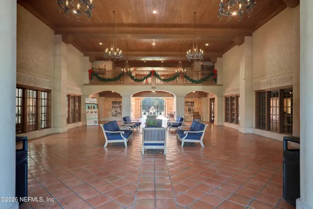 a view of a big room with lots of furniture and chandelier