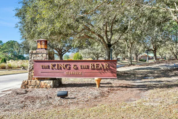 a sign that is sitting on a sidewalk