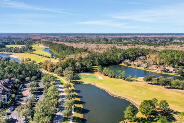 a view of a park with large trees