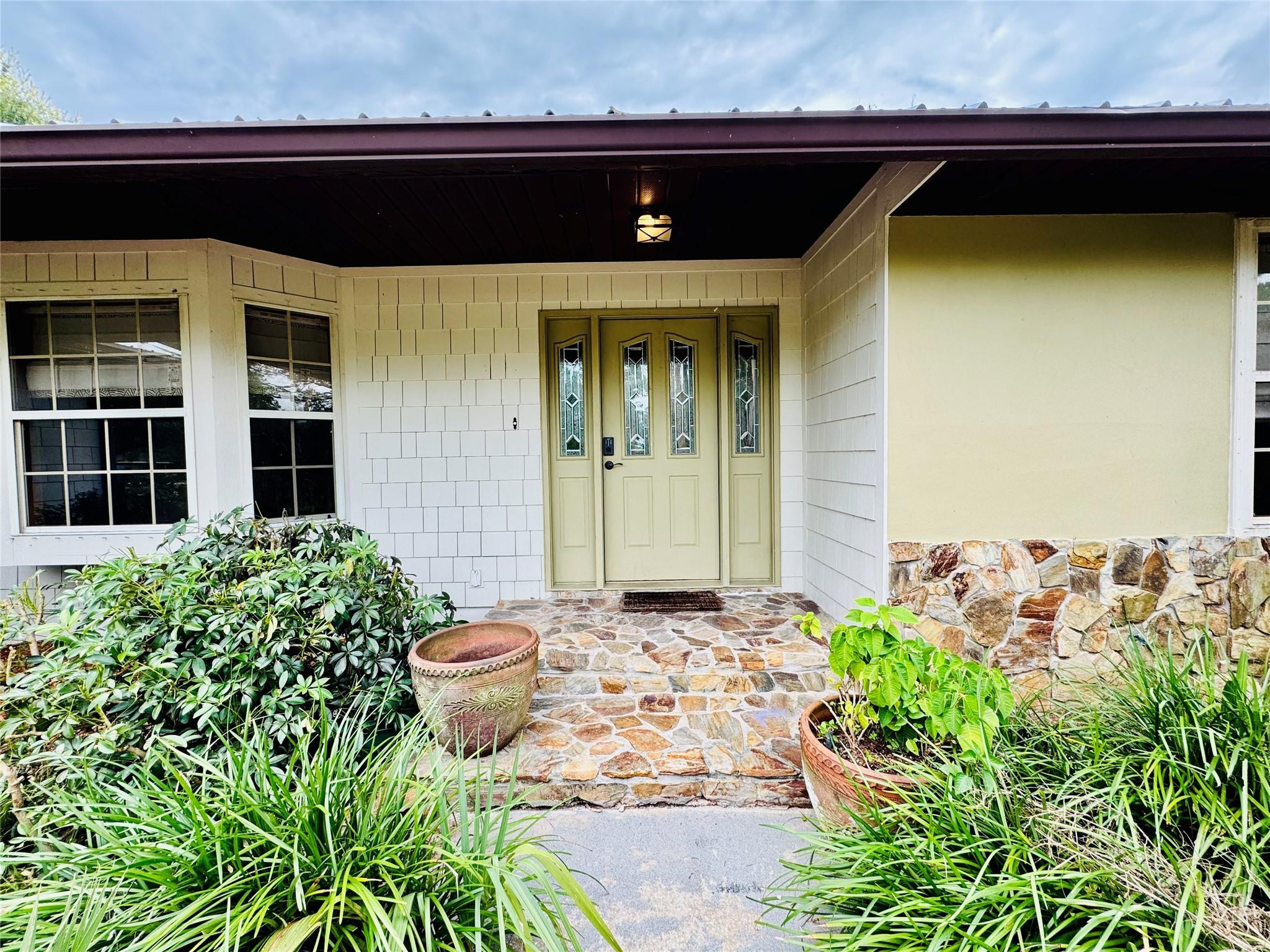 395 Southwest 30th Terrace Okeechobee, FL 34974 - Photo 2 of 57 a view of a house with potted plants