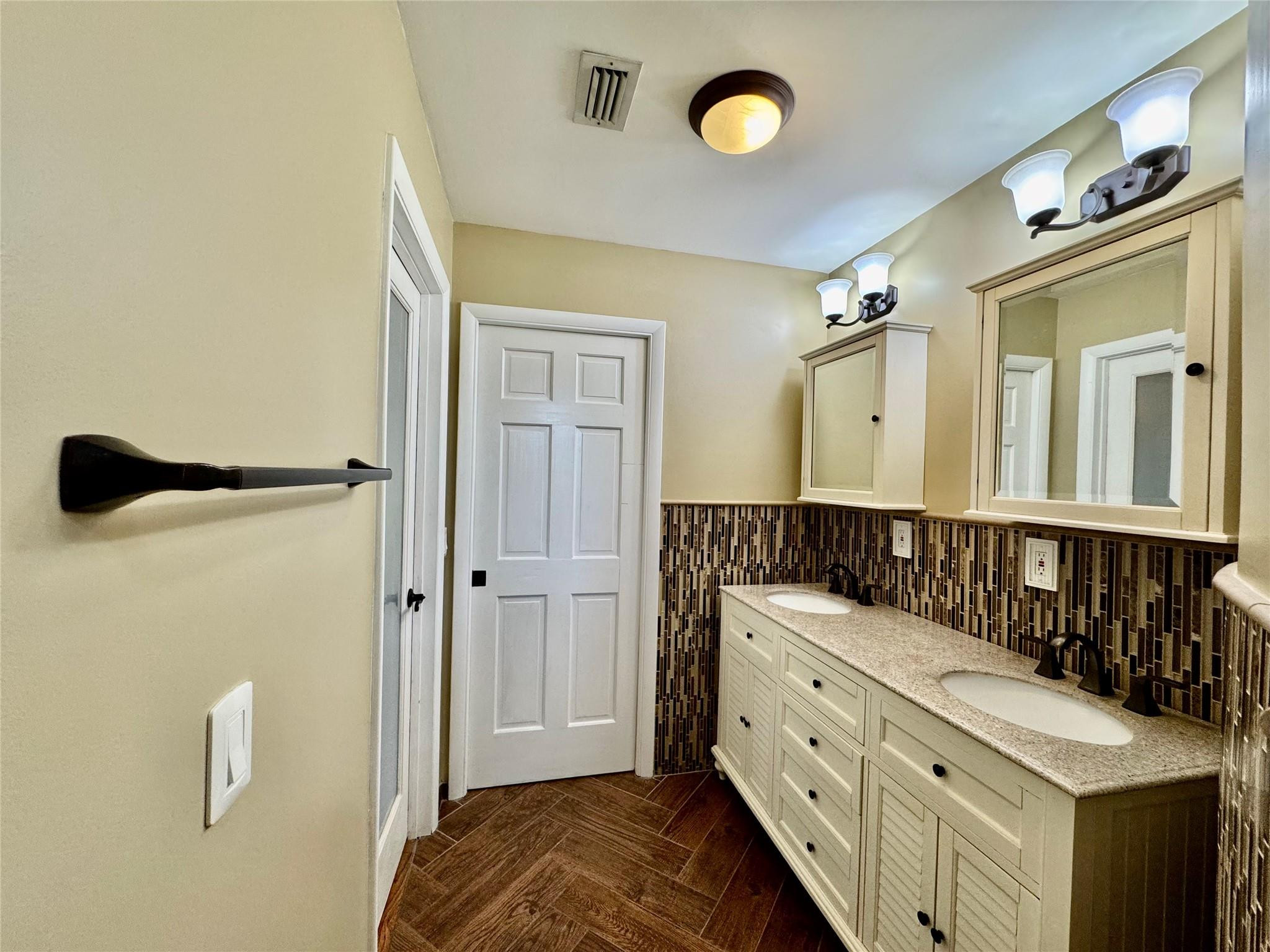 395 Southwest 30th Terrace Okeechobee, FL 34974 - Photo 24 of 57 a bathroom with a sink a mirror and shower