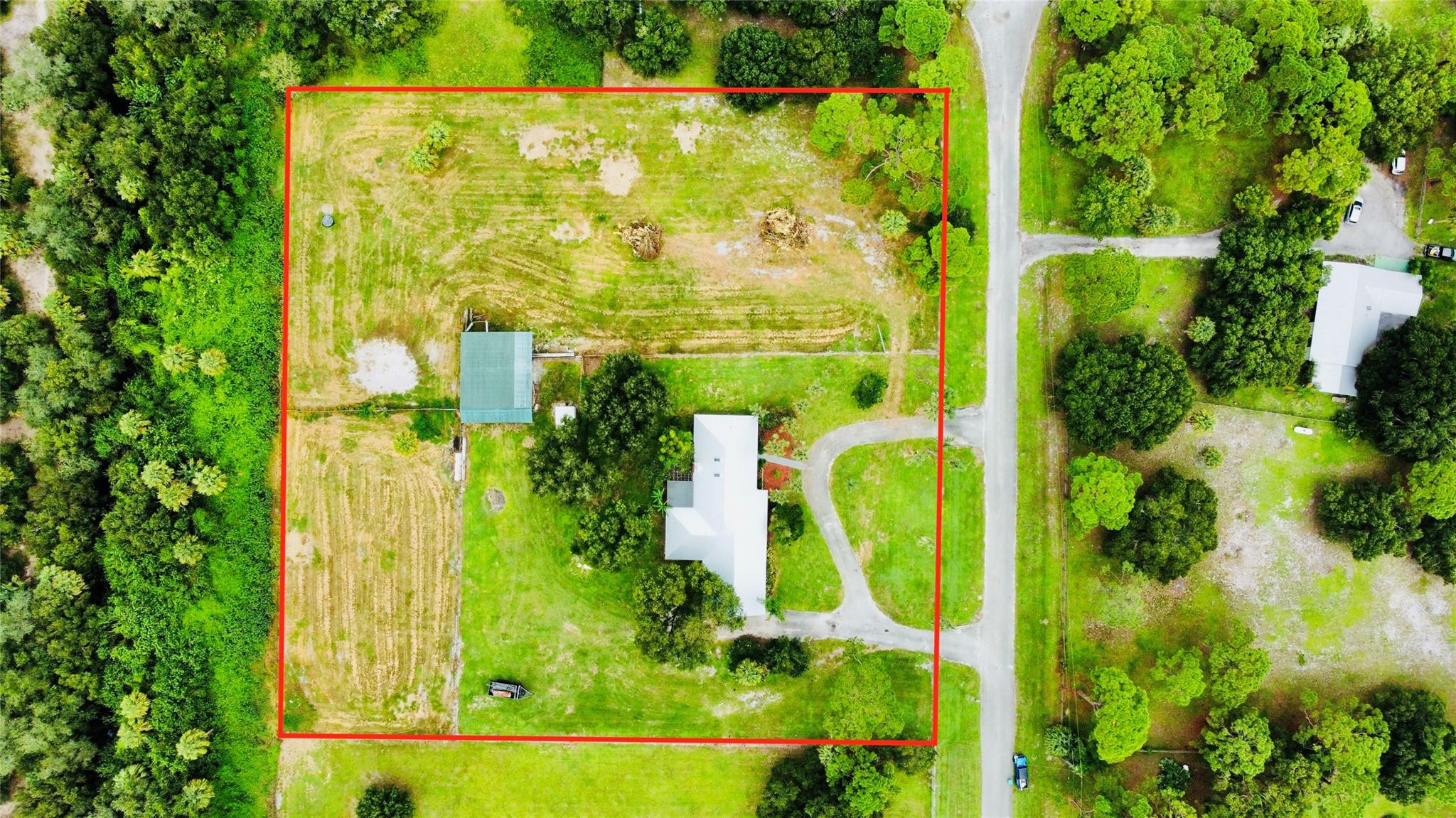 395 Southwest 30th Terrace Okeechobee, FL 34974 - Photo 39 of 57 an aerial view of a garden with swimming pool