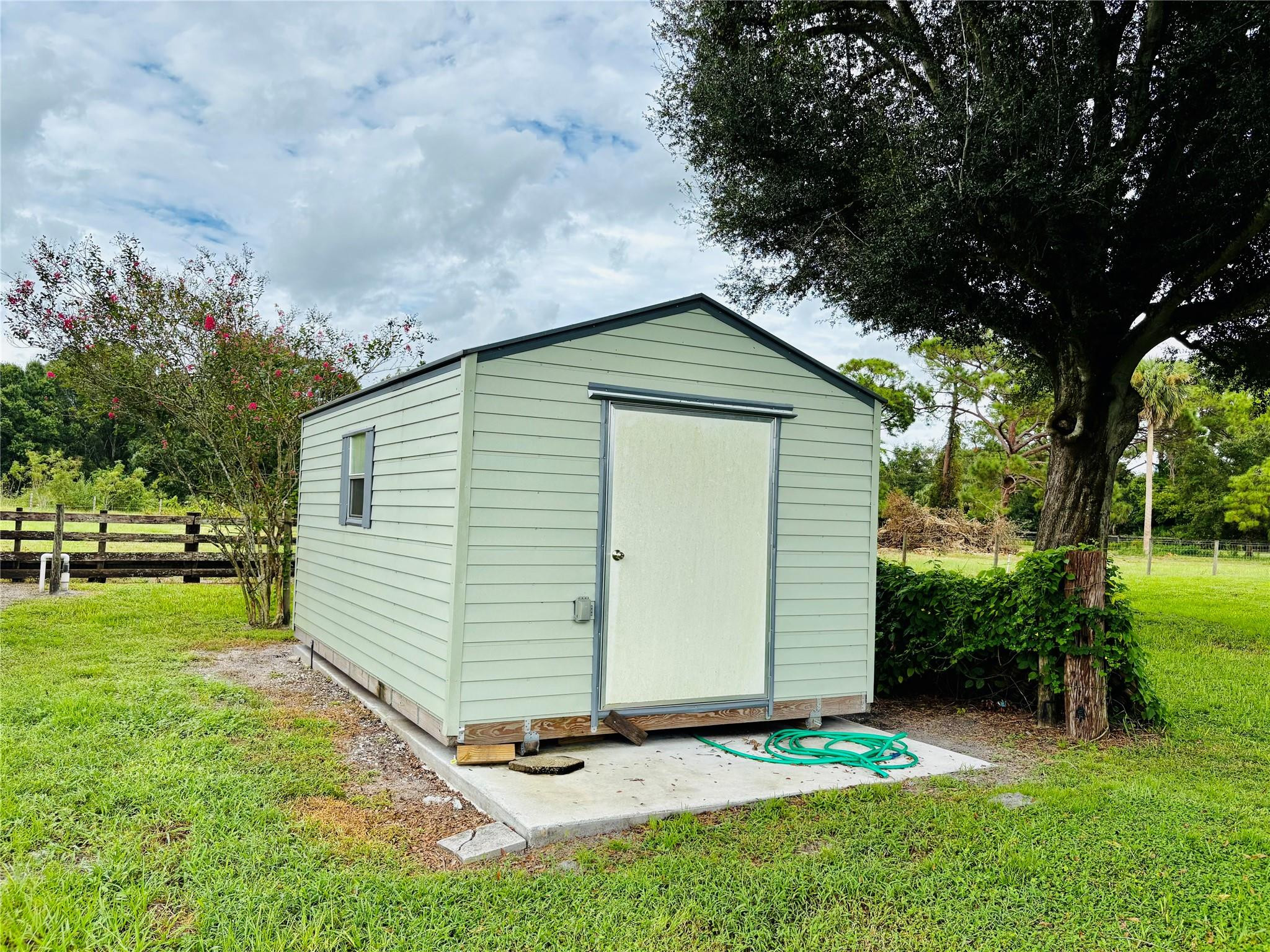 395 Southwest 30th Terrace Okeechobee, FL 34974 - Photo 48 of 57 a front view of a house with a yard