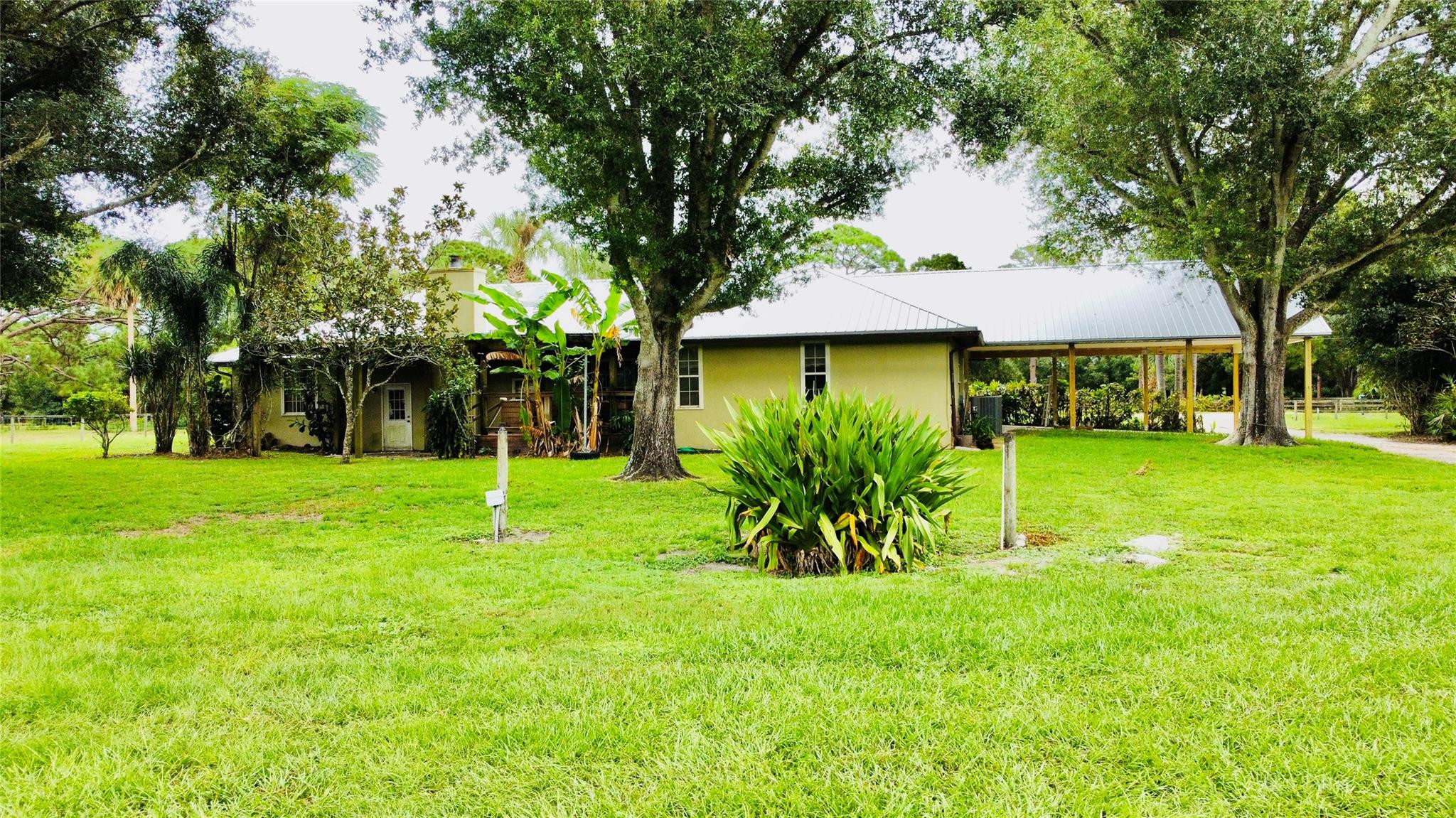 395 Southwest 30th Terrace Okeechobee, FL 34974 - Photo 51 of 57 a view of a yard in front of house