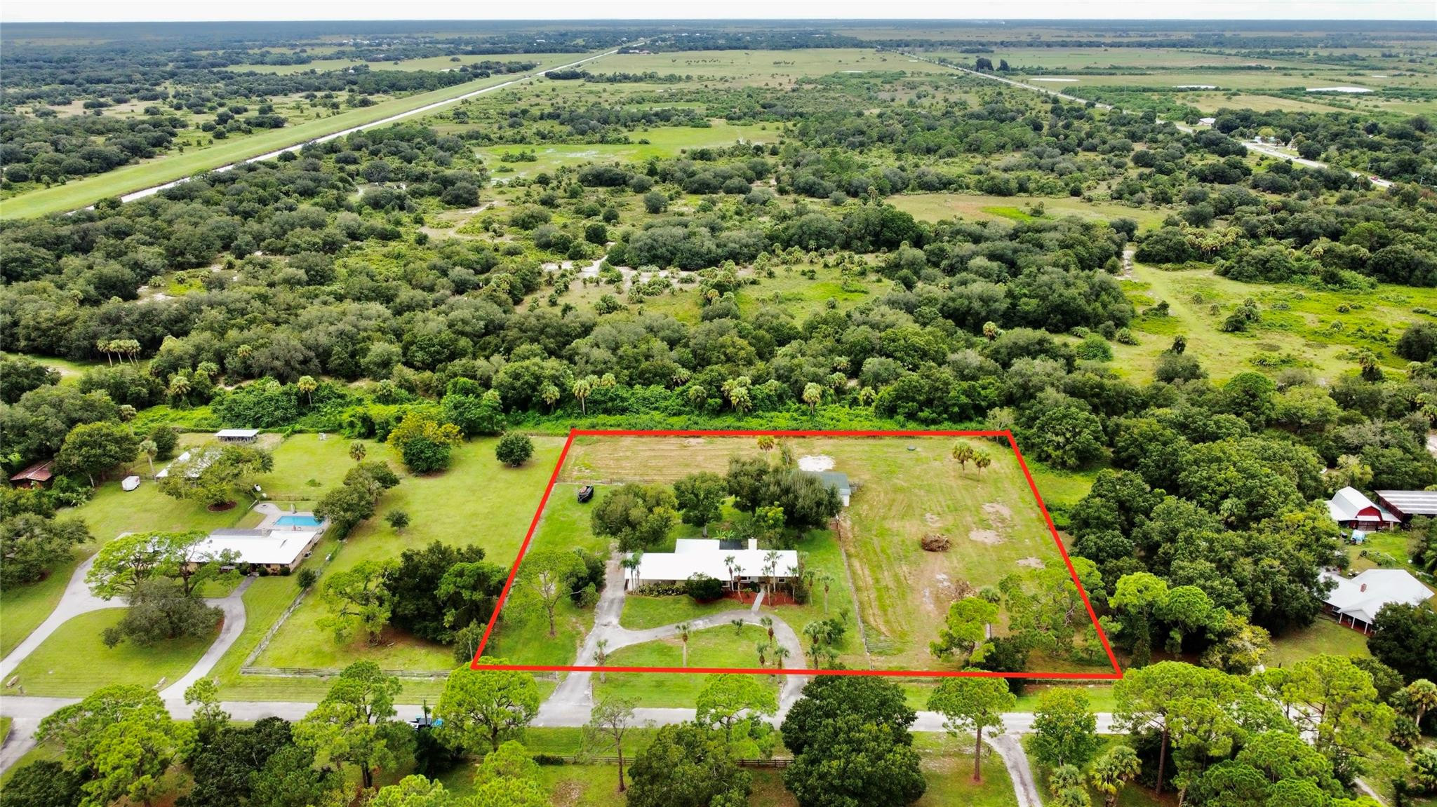 395 Southwest 30th Terrace Okeechobee, FL 34974 - Photo 54 of 57 an aerial view of residential houses with outdoor space