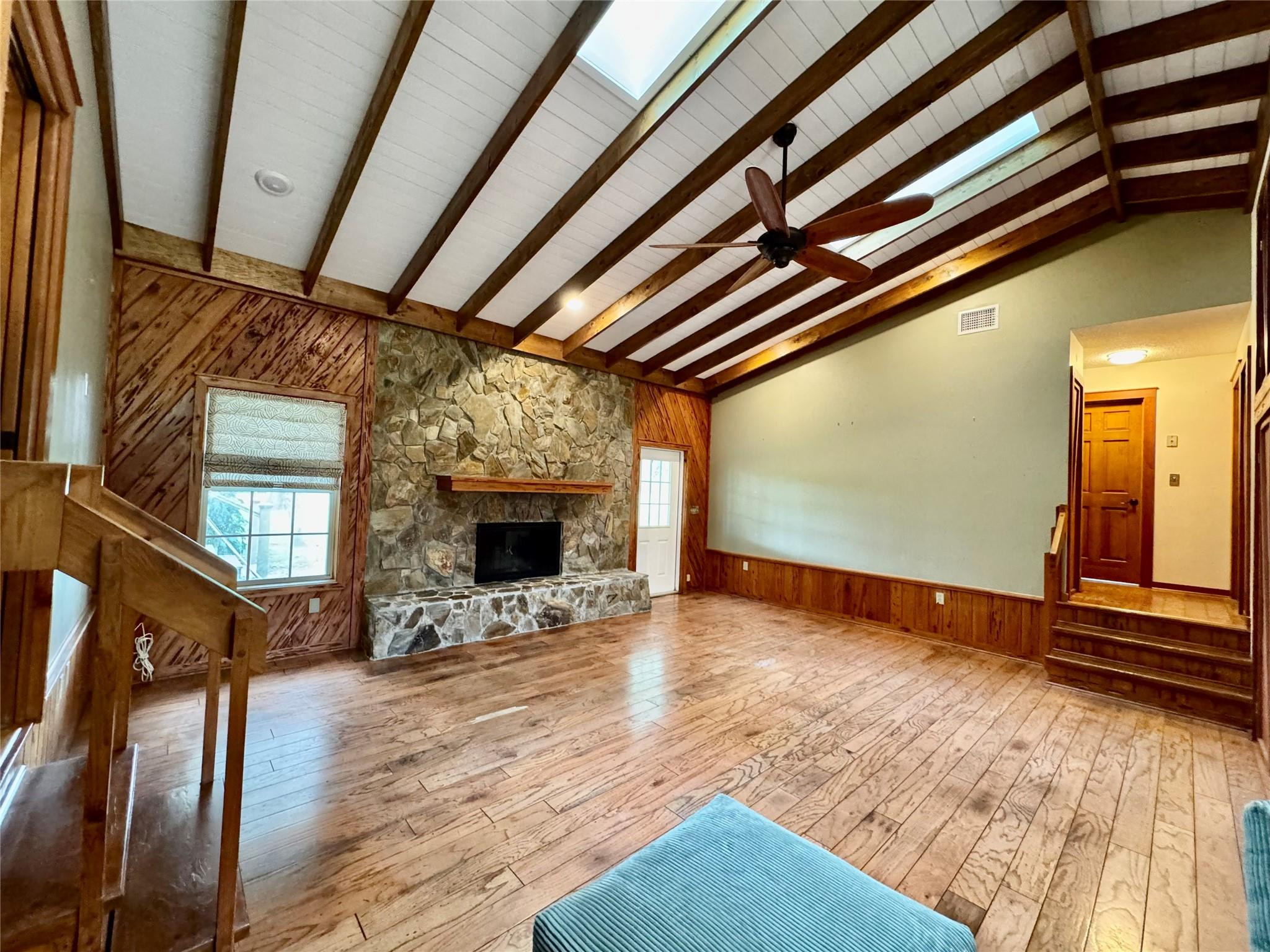 395 Southwest 30th Terrace Okeechobee, FL 34974 - Photo 7 of 57 a view of an empty room with wooden floor fireplace and a window