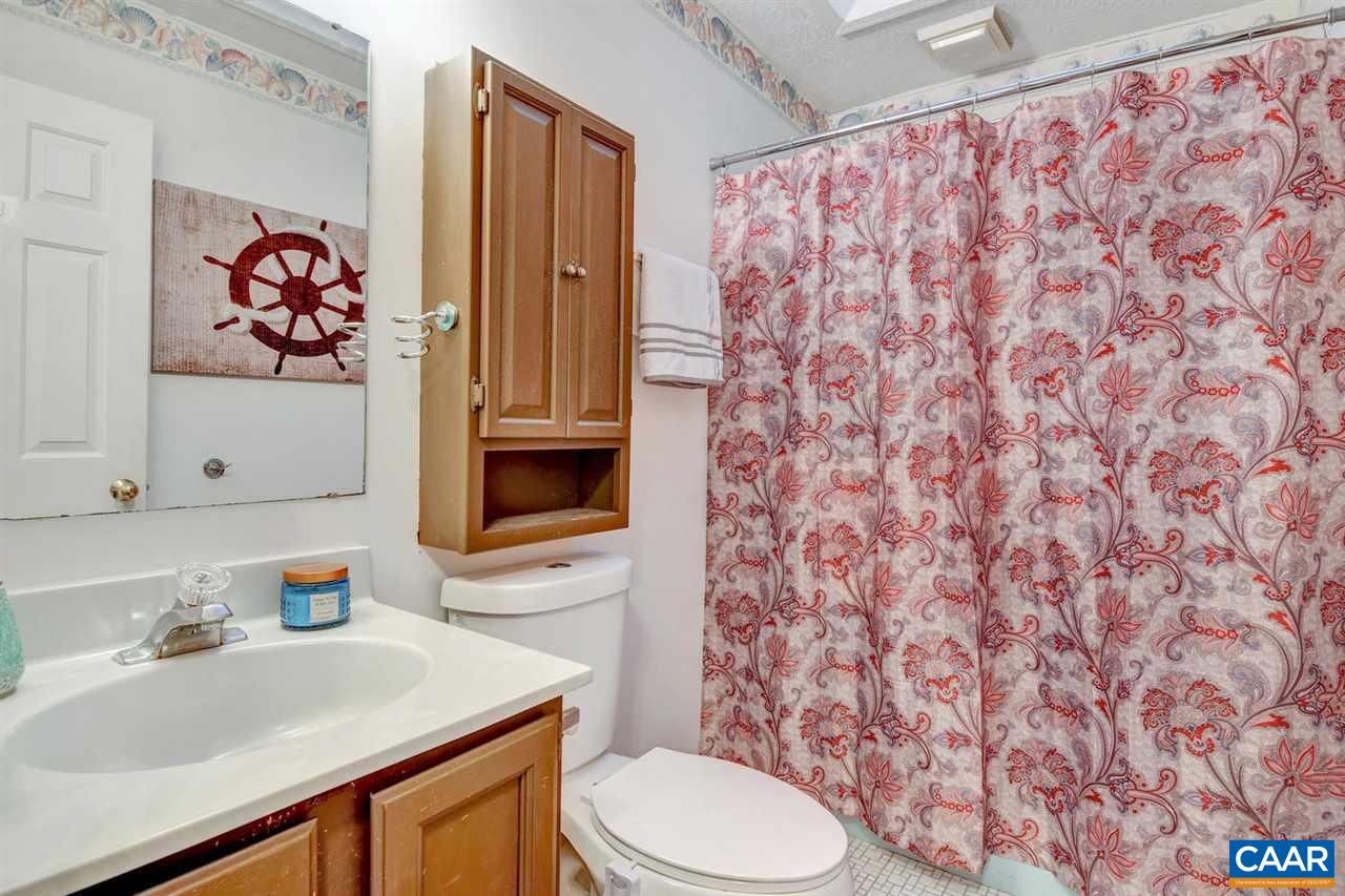 12 Laguna Road Palmyra, VA 22963 - Photo 21 of 50 a bathroom with a sink toilet and a mirror
