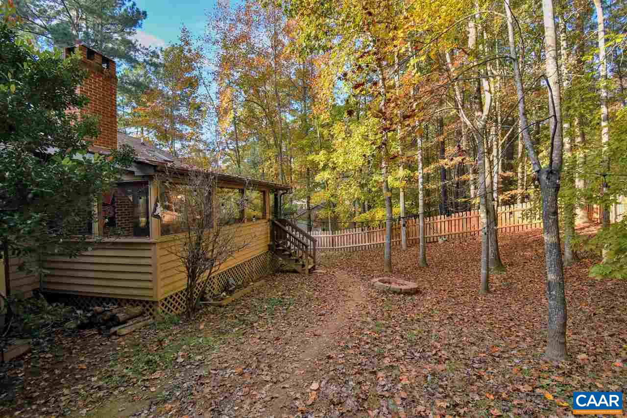 12 Laguna Road Palmyra, VA 22963 - Photo 27 of 50 a backyard of a house with lots of plants and trees