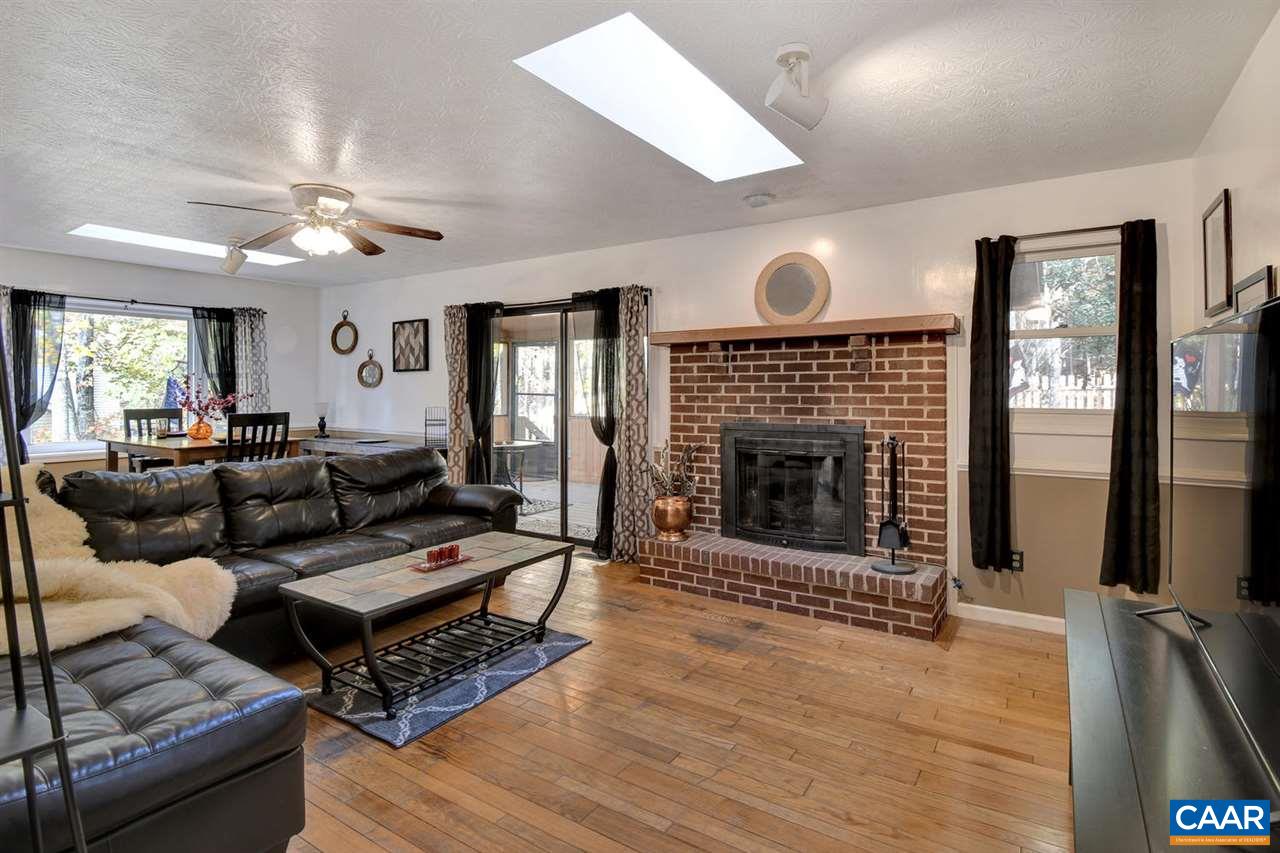 12 Laguna Road Palmyra, VA 22963 - Photo 6 of 50 a living room with furniture and a fireplace