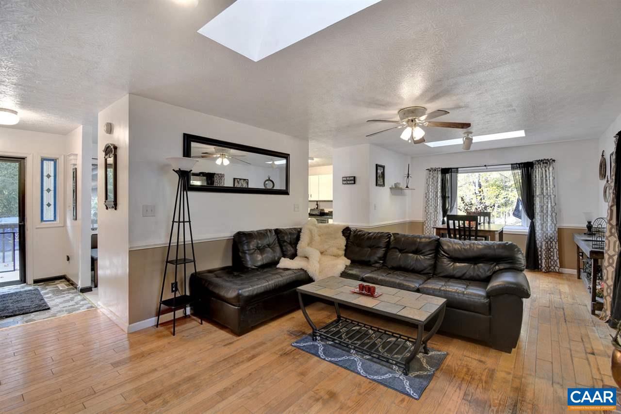 12 Laguna Road Palmyra, VA 22963 - Photo 7 of 50 a living room with furniture and a ceiling fan