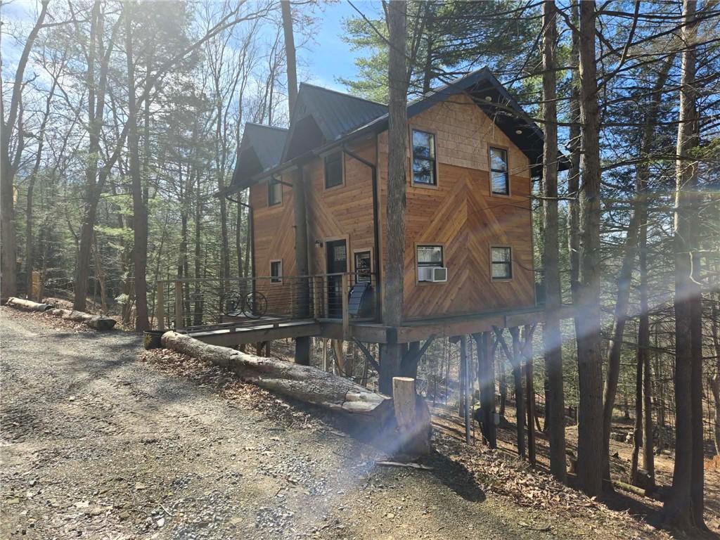 389 Winslow Hill Road Benezett, PA 15821 - Photo 13 of 33 a view of a chairs and table in the backyard