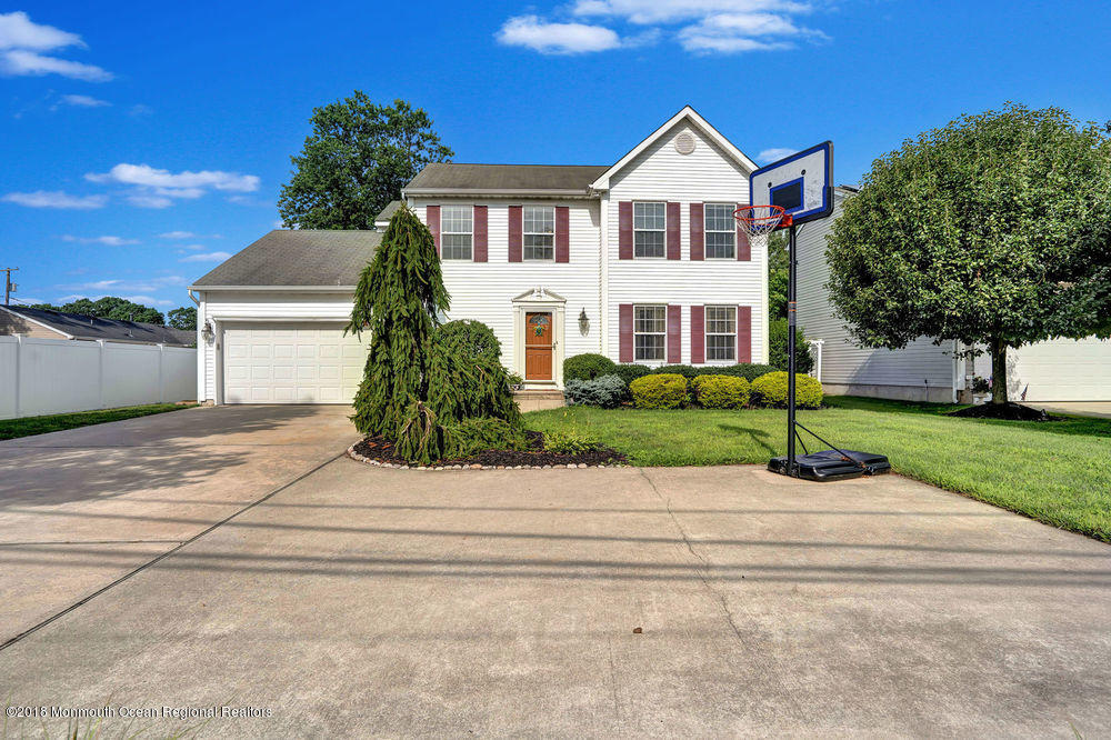 1505 Beaver Dam Road Point Pleasant, NJ 08742 - Photo 15 of 48 a front view of a house with a yard