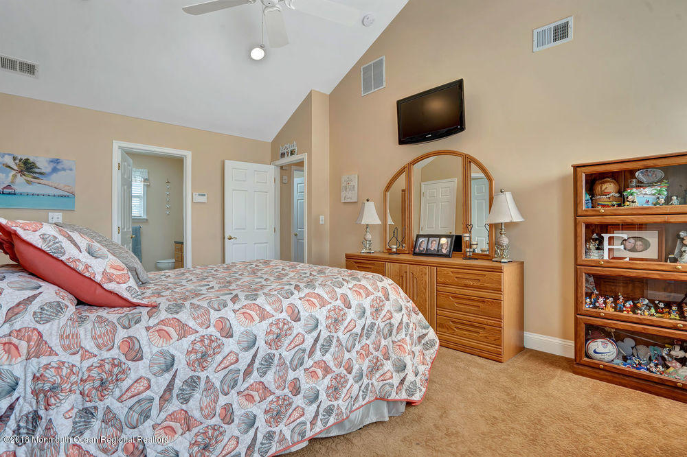 1505 Beaver Dam Road Point Pleasant, NJ 08742 - Photo 41 of 48 a bedroom with a bed and a television