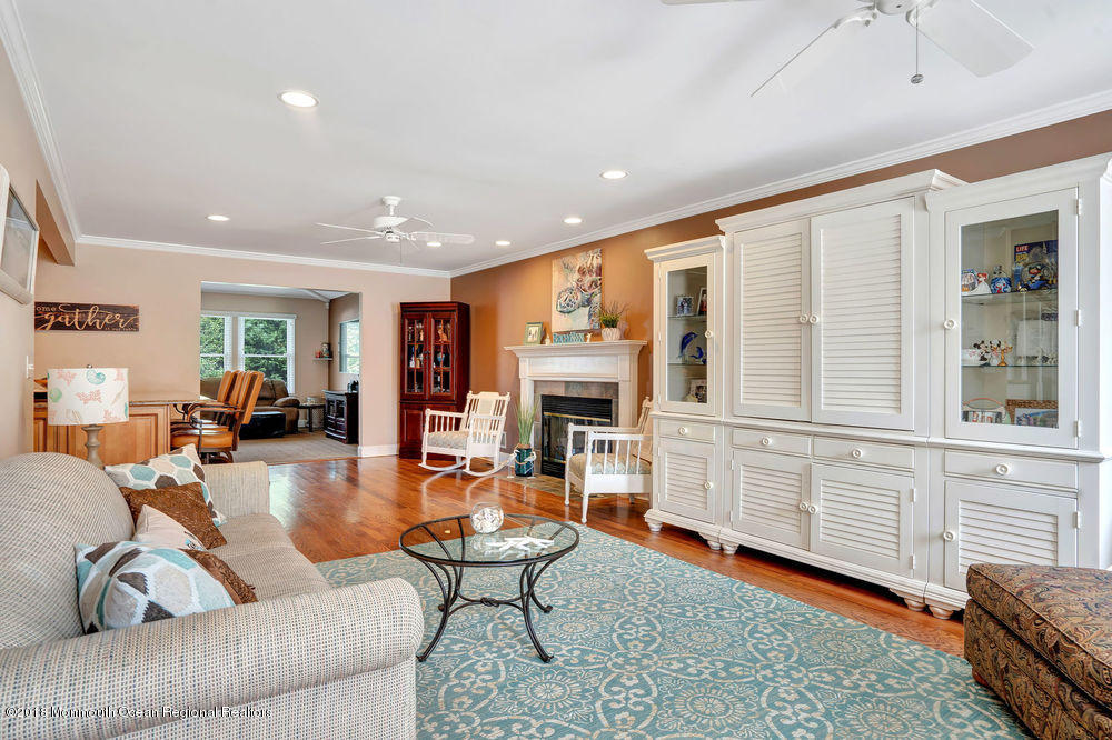 1505 Beaver Dam Road Point Pleasant, NJ 08742 - Photo 9 of 48 a living room with furniture wooden floor and a fireplace