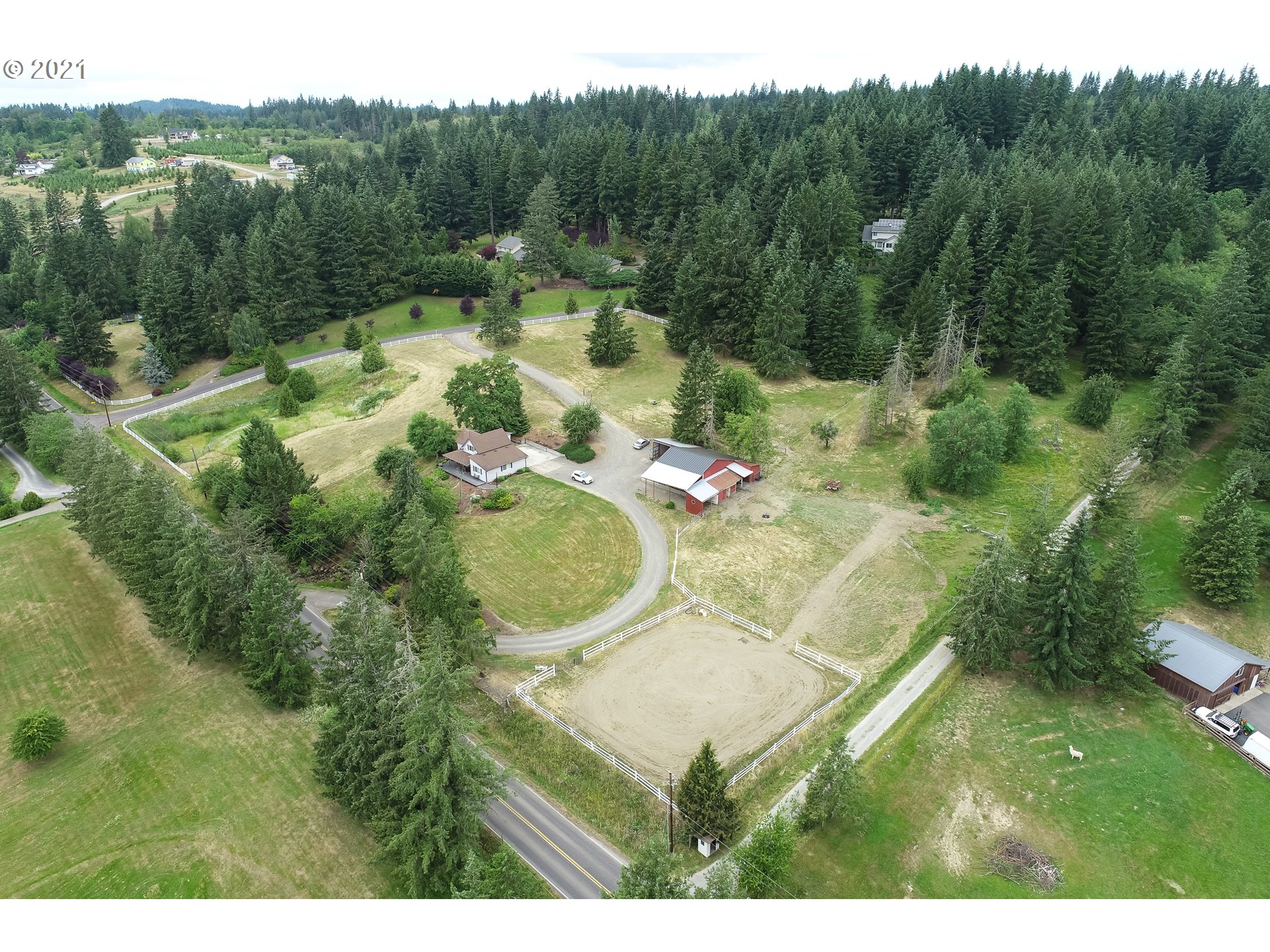 20512 Northeast Risto Road Battle Ground, WA 98604 - Photo 3 of 28 a backyard of a house with a yard and outdoor seating
