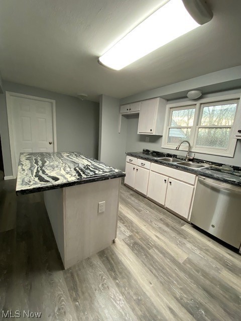 2216 Pressler Road Akron, OH 44312 - Photo 4 of 29 Kitchen with white cabinets, dishwasher, dark stone counters, sink, and light hardwood / wood-style flooring