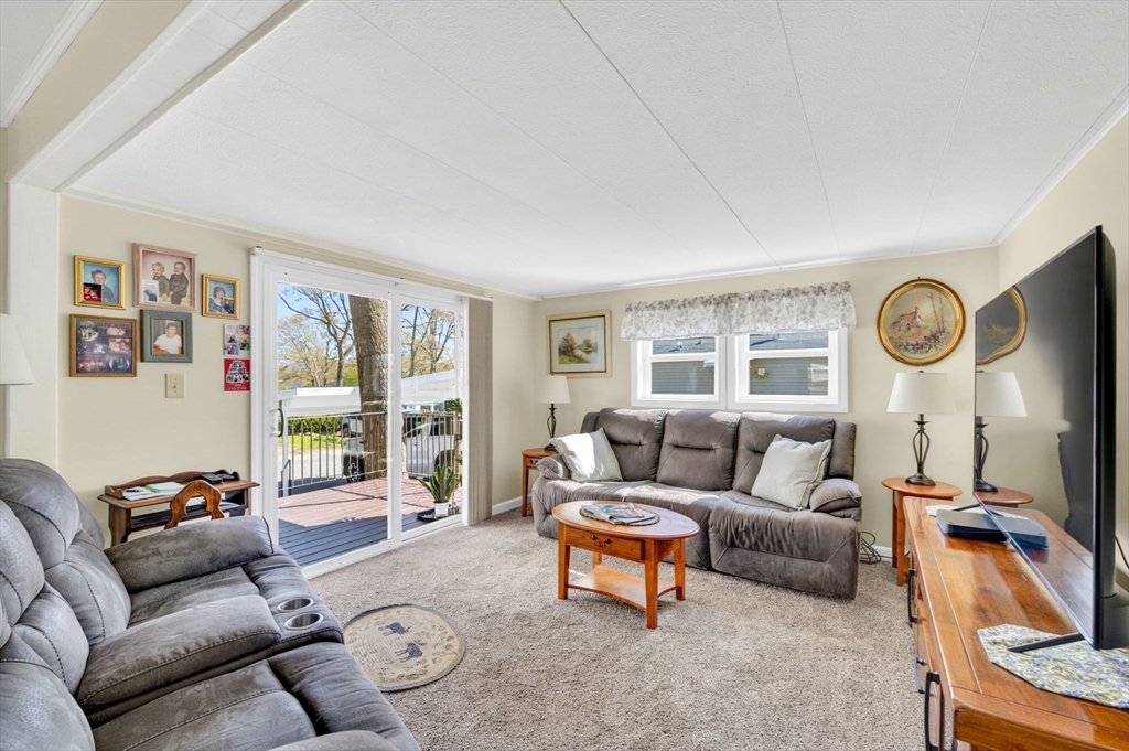 19 Timber Lane Wareham, MA 02571 - Photo 12 of 38 a living room with furniture and a large window