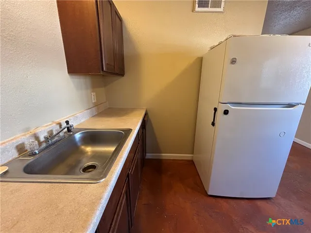 a bathroom with a sink and mirror