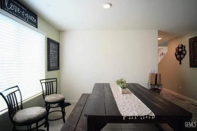 a kitchen with a sink a counter top space and stainless steel appliances