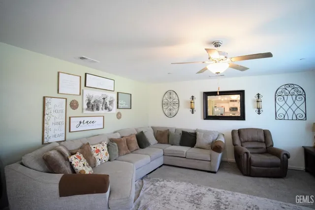a view of a hallway with paintings on the wall