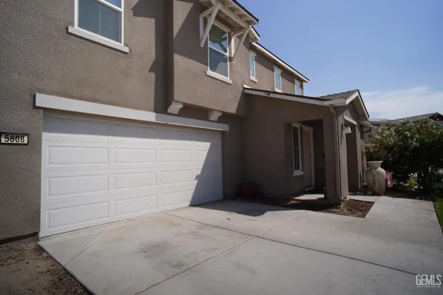 a front view of a house with a garage