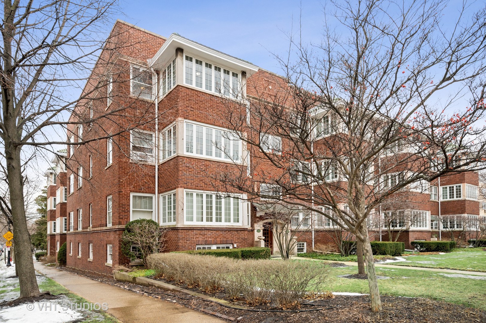 815 Ridge Avenue, Unit 3 Evanston, IL 60202 - Photo 1 of 16 a front view of a building with a yard