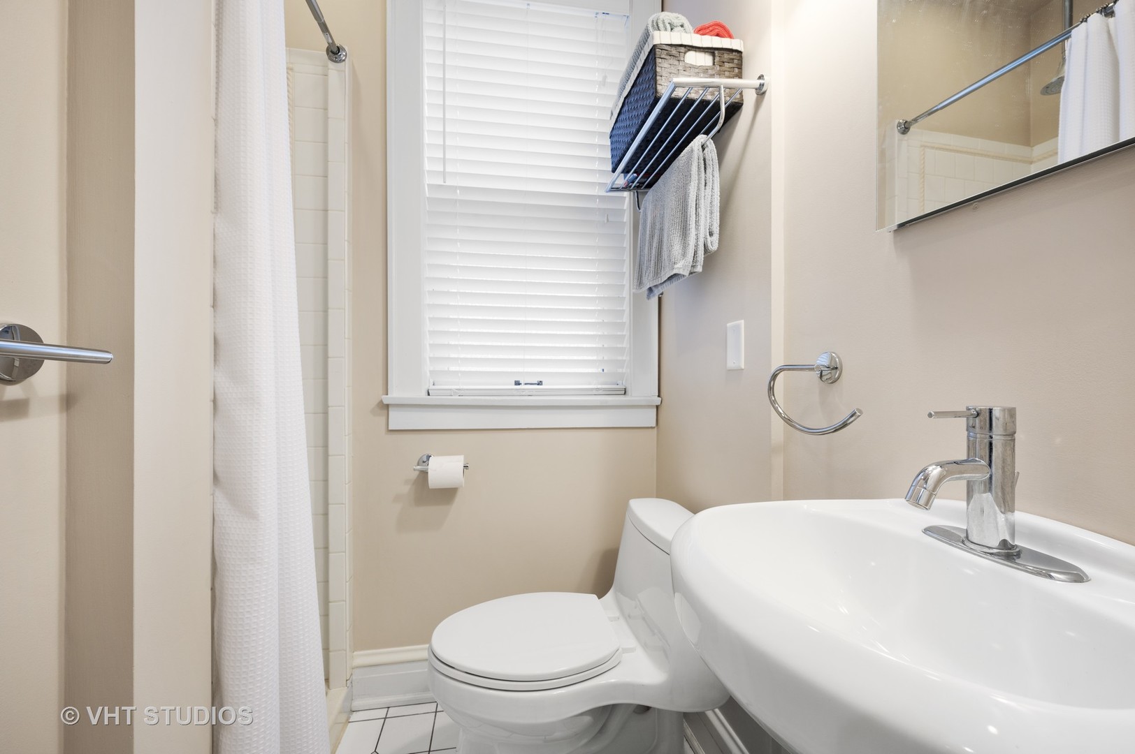 815 Ridge Avenue, Unit 3 Evanston, IL 60202 - Photo 13 of 16 a white toilet sitting next to a bathroom sink
