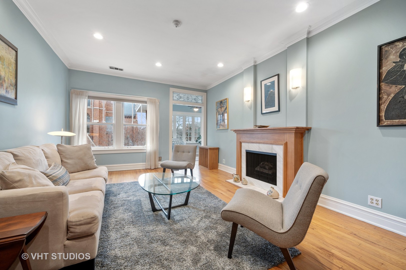 815 Ridge Avenue, Unit 3 Evanston, IL 60202 - Photo 3 of 16 a living room with furniture and a fireplace